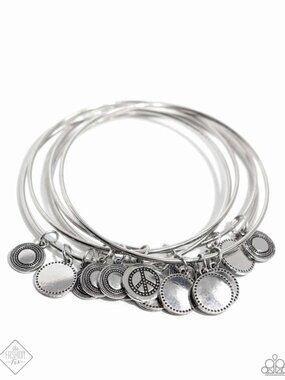 Set of 5 silver tone bangle bracelets with peace sign motif disc